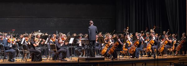 The R-H Orchestra performing on the Senior High School stage.